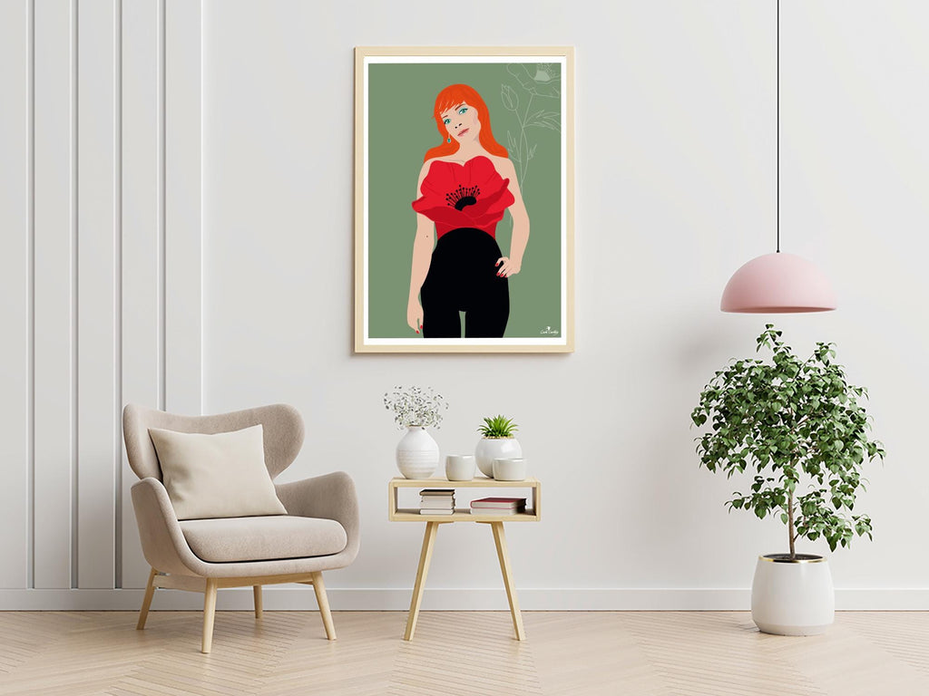 Affiche encadrée au style graphique : femme cheveux roux, robe rouge coquelicot, pantalon noir.